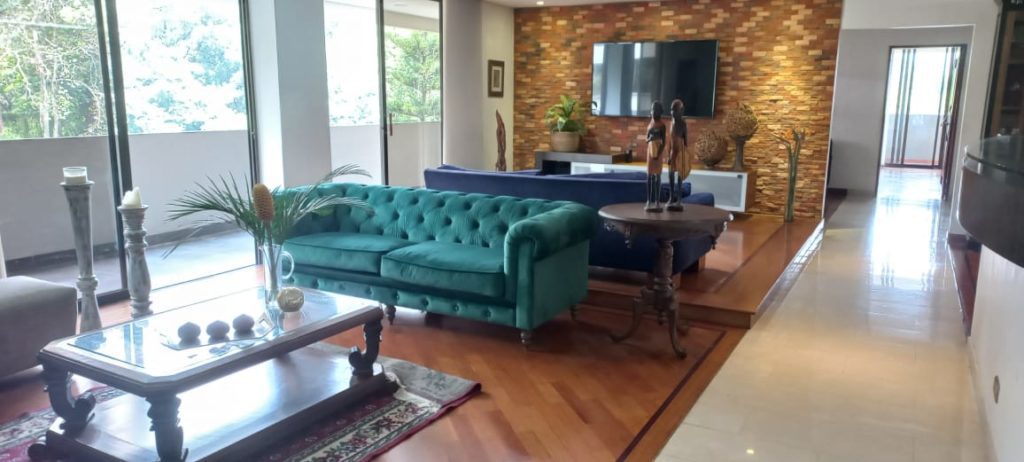 Below Market Spacious Envigado Condo on El Poblado Border and One Minute Walk to Shopping Centers