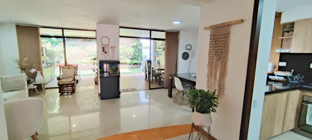 Two-Level El Poblado Townhome Steps From El Tesoro With Charming Backyard Space